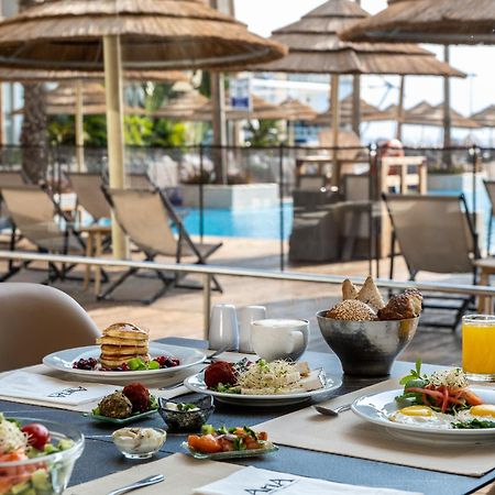 Aria Hotel Eilat Buitenkant foto A buffet at a hotel