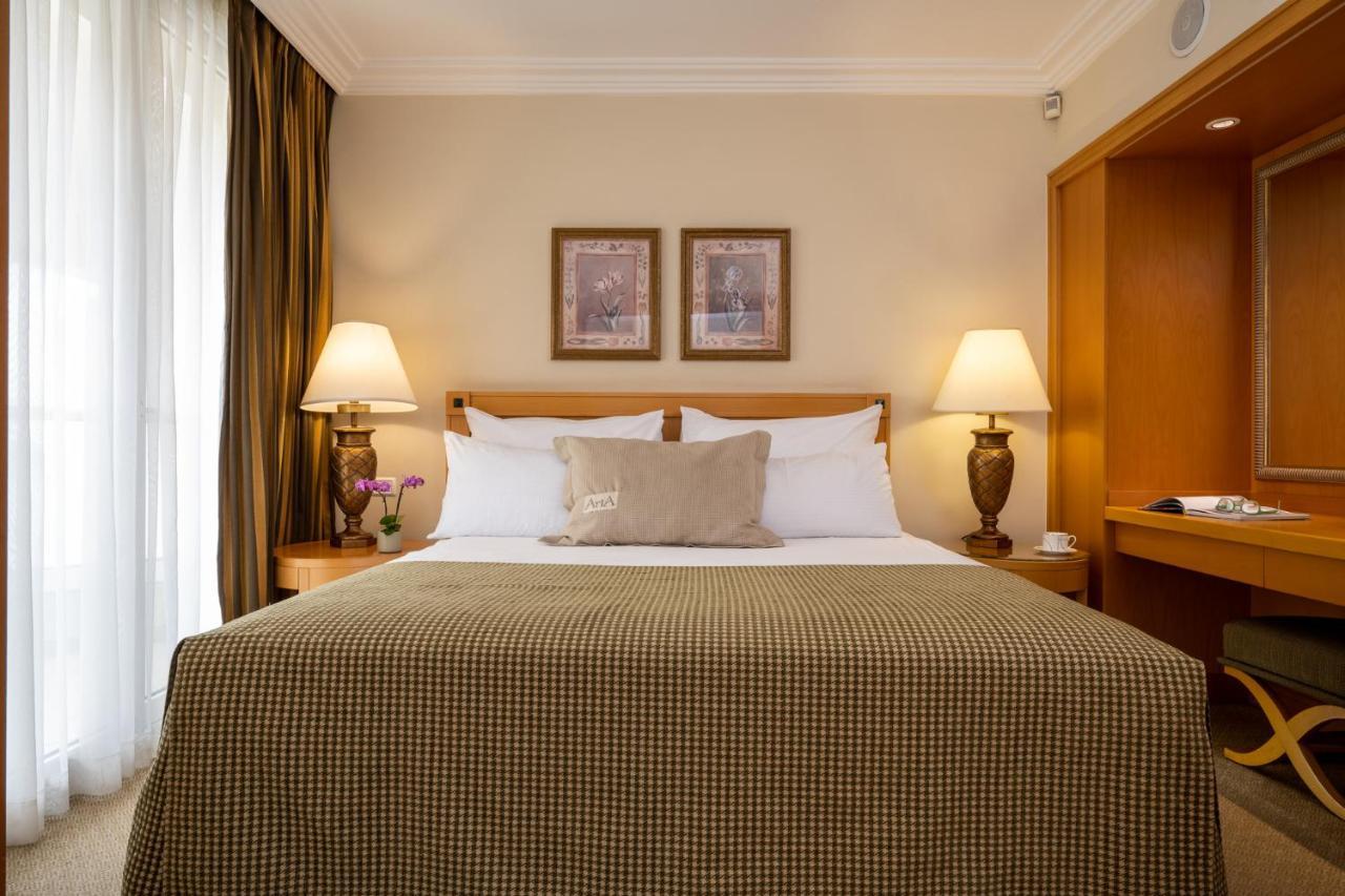 Aria Hotel Eilat Buitenkant foto A bedroom at the hotel